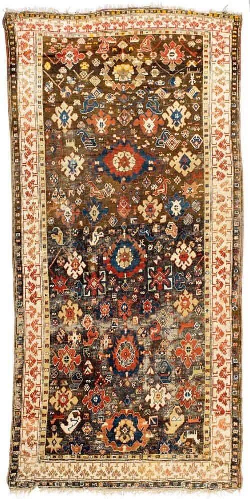 CAUCASIAN antique.Interesting piece with a dark ground, decorated with large flowers, light border with stylized trees, strong signs of wear, 420x200 cm.