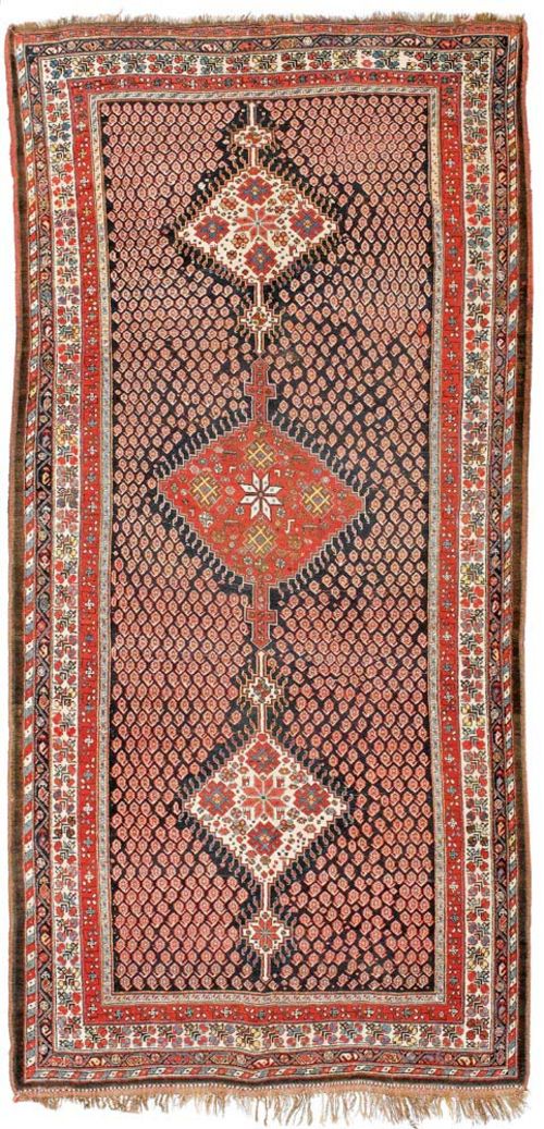 LORI GASHGAI antique.Dark blue ground with three medallions, decorated with stars, the central field is patterned with small boteh motifs, stepped border, good condition, 400x190 cm.