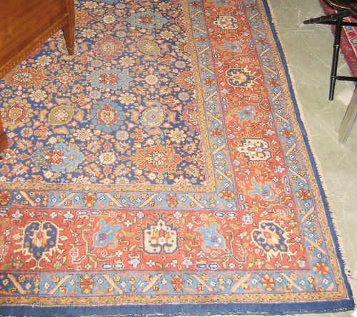 TABRIZ old.Blue central field entirely patterned with flowers and palmettes in harmonious colours, red border, good condition, 410x310 cm.
