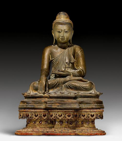 A BRONZE FIGURE OF BUDDHA. Burma, Mandalay-Style, around 1900, H 58 cm (without base). Married lacquer gilt wood base.