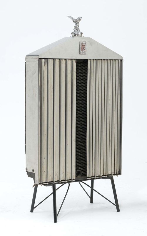 ROLLS ROYCE RADIATOR,1960s. Metal, partly chrome-plated. Front with lamellae (1 missing). Mounted on a stand with 4 legs. 112x55 cm.