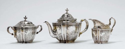 TEA SET,New York 1891-1902. Oval form with vertical lines and volutes and blossoms engraved all around. Comprising: tea pot, cream jug and sugar bowl. H 14 cm, 860g.