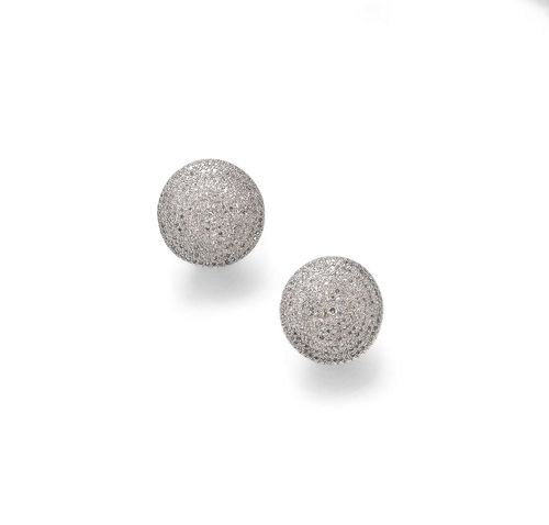 DIAMOND EAR CLIPS. Silver 800 and gold 375. Casual-elegant, round, slightly convex ear clips, pavé-set with numerous diamonds weighing ca. 1.40 ct in total.