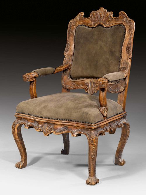 ARMCHAIR,Baroque, Mainfranken circa 1750. Richly carved walnut. Gray/green suede cover. 63.5x50.5x47x109 cm. Provenance: Baron Kuhlmann-Stumm collection in Schloss Ramholz, Germany.