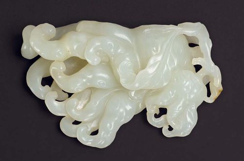 LEMON IN THE SHAPE OF BUDDHA'S HAND.China, 18th century. 7 cm. White jade. Highly-detailed carved fruit.