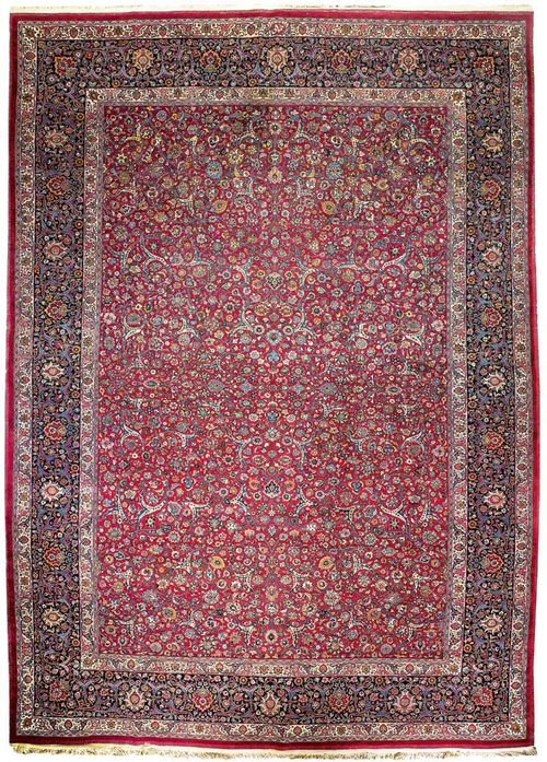 MESHED antique, signed. Red central field patterned throughout with trailing flowers and palmettes, dark blue border, good condition, 425x290 cm.