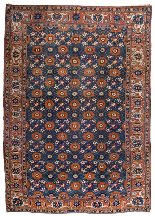 VERAMIN antique.Blue central field patterned throughout with red and white flowers, rust coloured border with trailing flowers, slight wear, 290x210 cm