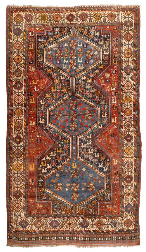 GASHGAI antique.Red central field with a blue medallion, geometrically patterned with depictions of plants and animals, white trim, signs of wear, 157x287 cm.