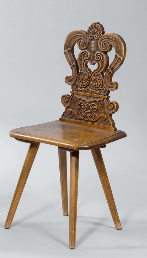 CARVED STABELLE CHAIR, in the Baroque style, from the Alpine region. Walnut and beech, carved with volutes and leaves. Open-worked, curved back.