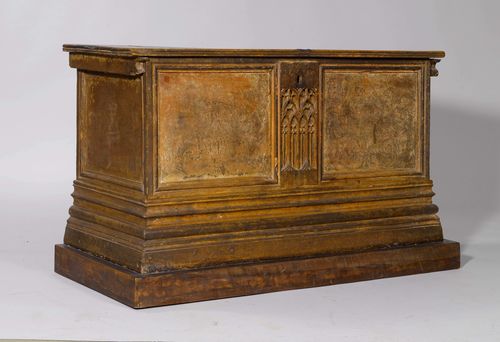 CHEST, Gothic and later, probably Germany. Walnut and lime, carved and with remains of paint. Rectangular body with hinged cover on a stepped (partly later) base. Recessed front. 123x56x72 cm. Cover, later.