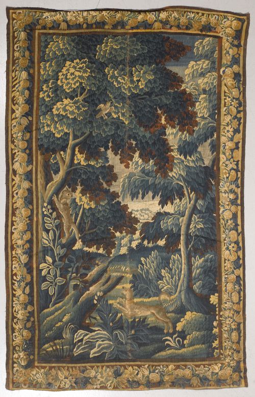 TAPESTRY, France, 17th/18th century. Depiction of a hunting dog in a landscape with trees. Flower border. 300x181 cm.