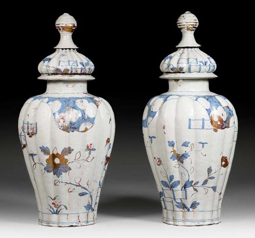 PAIR OF FAIENCE 'IMARI' VASES WITH LIDS, Ansbach, circa 1720.H 52cm. Paint and gilding heavily rubbed, chips in the lids.