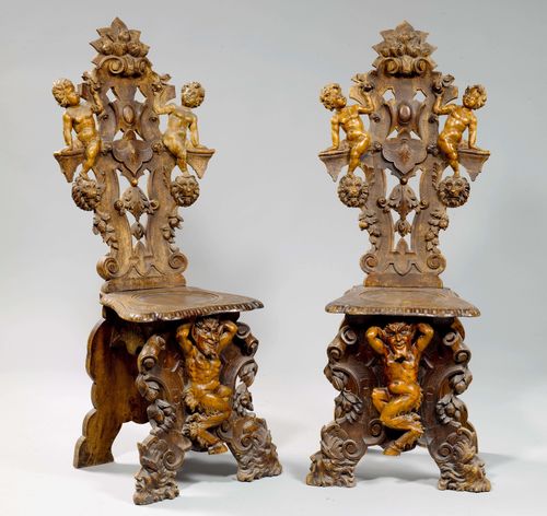 PAIR OF CARVED SGABELLI, Baroque style, Italy, 19th century. Walnut, richly carved with putti, lion heads, satyr, flowers and leaves. Some losses, requires restoration.