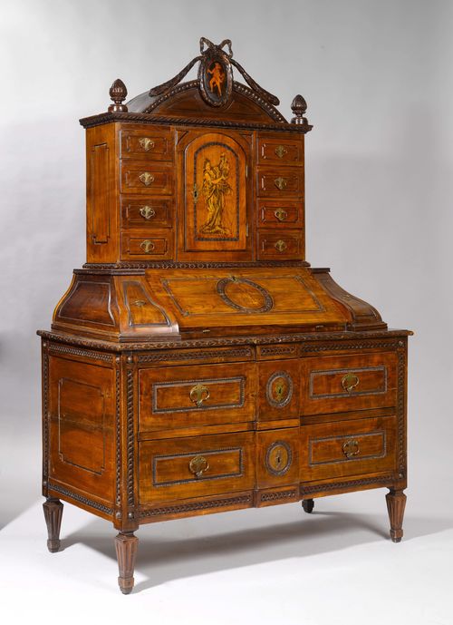 BUREAU CABINET, Louis XVI, Northern Germany. Oak, carved with decorative friezes, bows and garlands, and inlaid and painted with figures. Top with 8 drawers, centre part with foldable writing surface opening onto 4 drawers and 1 compartment. Lower part with 2 drawers. Brass mounts. 128x65(90)x190 cm. Provenance: Gut Aabach, Risch am Zugersee.