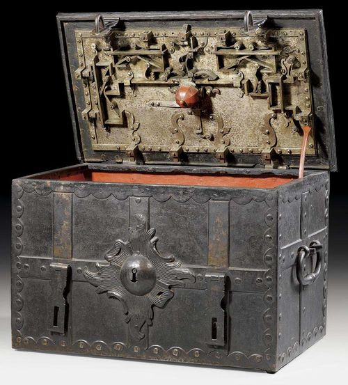 LARGE WROUGHT IRON COFFER,Renaissance, German circa 1680. With salient lid and interior drawer. Finely engraved iron lock. Painted red inside. 95x48x46 cm. Provenance: Private collection, Switzerland.