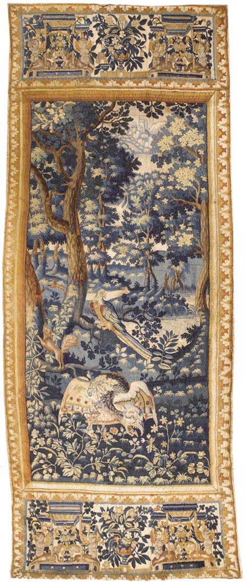 NARROW VERDURE TAPESTRY "AU PERROQUET",late Gothic, Flemish, probably Oudenaarde circa 1580. With fabulous creatures, parrots and other animals in an idealised landscape. With fine floral and foliate border. H 296 cm, W 113 cm. Provenance: Private collection Zurich.