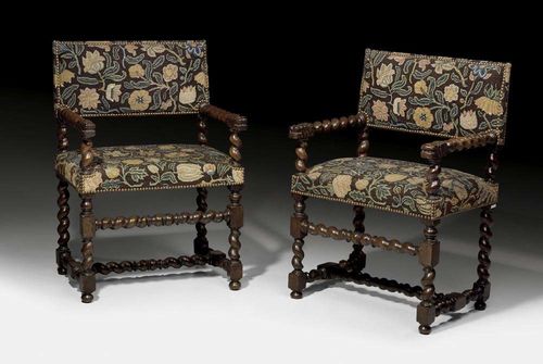 PAIR OF WALNUT ARMCHAIRS,Baroque, probably  Italy, 18th century With turned columnar legs joined by stretcher. The flat and fully upholstered backrest with corresponding armrests on supports in the form of fabulous creatures. With polychrome "Gros Point" covers with flowers and leaves and decorative nail work. 60x41x50x88 cm. Provenance: Private collection Zurich