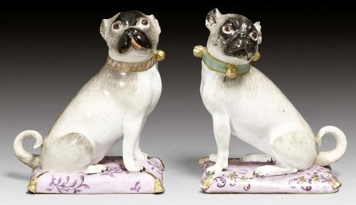 PAIR OF SITTING PUGS ON PILLOWS, MEISSEN, MODEL J.J. KAENDLER, CIRCA 1740-45.Without marks. H 11.3cm and 11.5cm. Both tails restored at the base, minor chips. (2)
