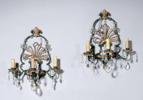 A PAIR OF APPLIQUES, Régence style. Metal painted green and gilded. Glass hangings. H 50 cm. Fitted for electricity.