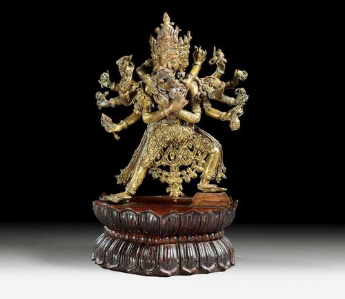 CAKRASAMVARA.Nepal, 18th century. H 15.5 cm (without plinth). Copper alloy with remains of gilding. Later wooden plinth.