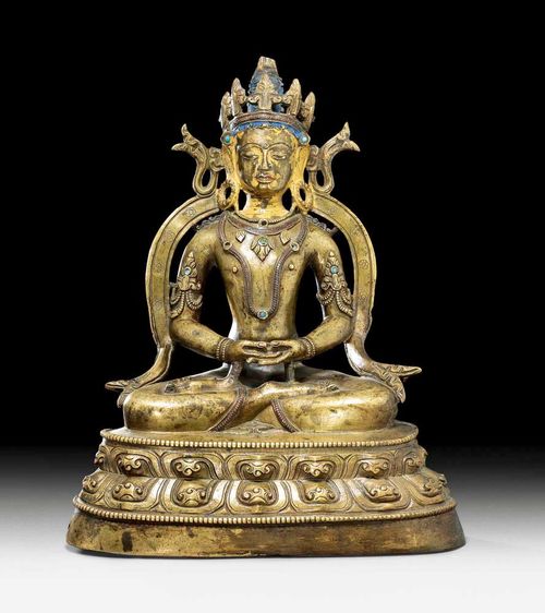 TATHAGATA AMITHABA.Western Tibet, 14th century. H 26 cm. Ungilded bronze with remains of cold painted in the face and hair. The head band and necklace are inlaid with copper, the jewellery is decorated with turquoises.