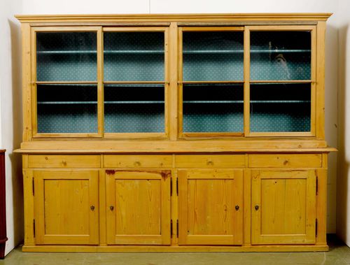 SIDEBOARD WITH VITRINE UPPER SECTION,late Biedermeier, from the Alpine region, mid-19th century. Pine. Rectangular body. Slightly retracted vitrine upper section with 4 sliding doors. Lower section with 4 drawers over 4 doors. Brass escutcheons. 289x58x213 cm. 4 keys. Sliders replaced with oak.