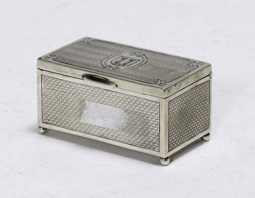 SMALL TOBACCO TIN,Austria after 1866. Maker's mark: MG. Chest-shaped. Engine-turned all around on four feet with a hinged cover. 6.5x3.5 cm, 59 g.
