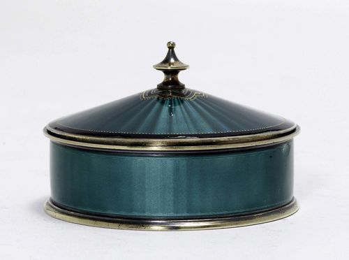 ENAMEL BOX WITH COVER,Norway 20th century. Round, enamelled in turquoise all around over engine-turned background. Cone-shaped knob. D 9 cm, 170 g.
