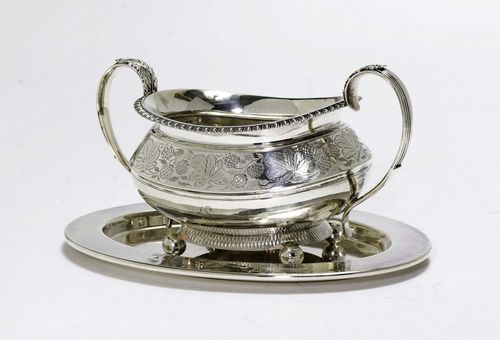 TRAY AND SUGAR BOWL,20th century. Matching.  Silver and silver-plated. England and WMF. Oval, silver-plated tray. Oval sugar bowl on four spherical feet with profiled handles on both sides. Florally engraved shoulder. With protruding rim. H 8 cm, 278 g.