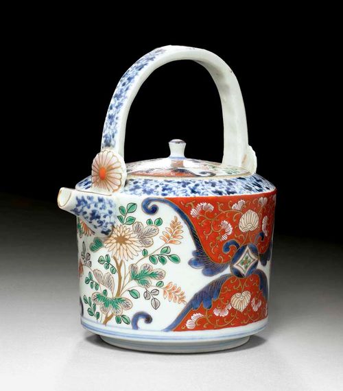 IMARI JUG.Japan, Arita, 18th century H 19 cm. With chrystanthemums on white ground and tendrils on iron red ground. Well conserved. German private collection. Acquired in Japan in the 1960s. On loan for a long period at the Museum for East Asian Art in Cologne.