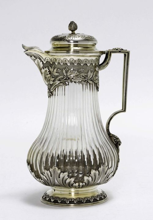 CARAFE,Paris, 19th century. With maker's mark. Ribbed glass. Foot, handle and cover and spout, silver. H 28 cm.
