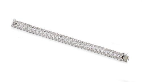 DIAMOND BRACELET, ca. 1950. White gold 750, 34g. Decorative bracelet of 27 open-worked, geometrically designed links, decorated with a total of 135 diamonds weighing ca. 2.80 ct, with an integrated clasp. L ca. 17 cm.