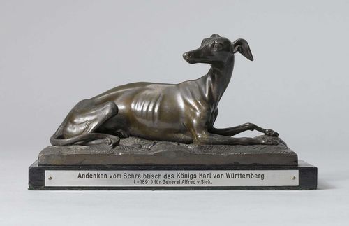 FIGURE OF A GREYHOUND, German, 19th century. Pewter cast. Inscribed "Andenken vom Schreibtisch des Königs Karl v. Württemberg für General Alfred von Sick". L 20 cm.