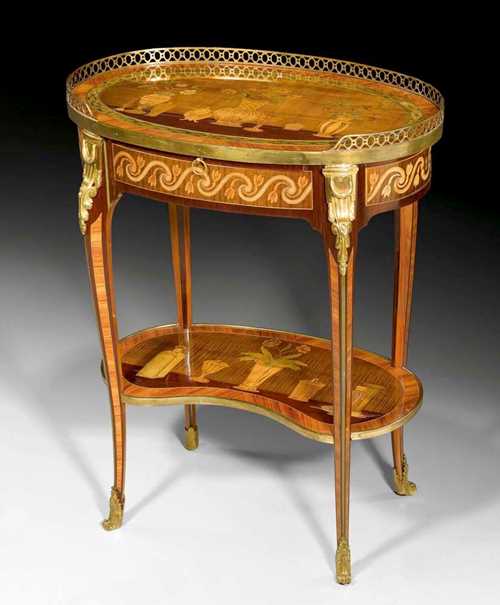 OVAL GUERIDON,Louis XV, stamped D. DELOOSE (Daniel De Loose, maitre 1767), guild stamp, Paris circa 1770. Tulipwood, rosewood and partly dyed precious woods in veneer and finely inlaid on all sides with flowers, leaves, vessels, bands and frieze. The top edged in pierced brass rail, one leather-lined sliding ledge at the front and one drawer at the side. Fine gilt bronze mounts and sabots. 60x37x76 cm. Provenance: - Galerie Gismondi, Paris. - from a highly important European private collection.