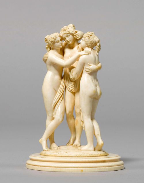GROUP WITH THE THREE GRACES,after Antonio Canova, Italy, late 19th century. Ivory, fully carved in the round. Set on an oval plinth. H 16 cm.