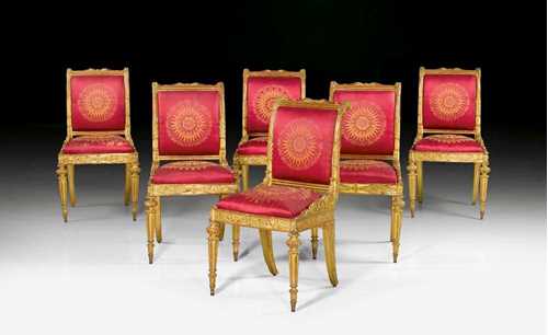 SET OF 8 GILTWOOD CHAIRS,late Empire, sign. I.V. RAAB (Johann Valentin Raab, 1777-1839), Frankfurt, 19th century Fluted and richly carved wood frames with flowers, cartouches and leaves. Red silk covers with Empire pattern. 2 chairs with damaged light yellow silk covers. Requiring some restoration. 49x41x45x81 cm. Provenance: Private collection, Brissago.
