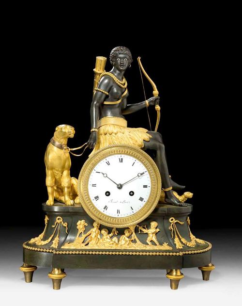 MANTEL CLOCK "L'AFRIQUE",Directoire, the model by J.S. DEVERBERIE (Jean Simon Deverberie, died 1824), the dial signed REVEL A PARIS (Joseph Revel or Renel, maitre 1774), France circa 1800. Matte and polished gilt bronze and burnished bronze. With the figure of a black huntress on the clock case, together with a leopard and turtle. The clock with enamel dial and fine anchor escapement striking the 1/2 hours on bell. 37x10x58 cm. Provenance: Private collection, Germany.