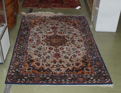 ISFAHAN old.White central field decorated with colourful plants and animals, red border, slight wear, 150x100 cm.