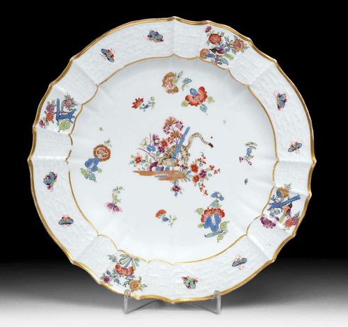 PLATE WITH 'YELLOW LION' DECORATION, Meissen, circa 1740.Gold painted 'Altbrandenstein' form. With Yellow Lion and scattered Indianische Blumen and insects. Underglaze blue sword mark, impressed number 22. D 24 cm. Provenance: from a Swiss private collection.