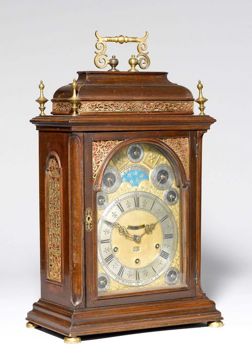 CLOCK WITH MOON PHASE AND PERPETUAL CALENDAR,Germany or England, 18th/19th century. The dial merchant's signature MAYER LONDON. Mahogany. Rectangular case with retracted top. Finely engraved fronton, silver-plated chapter ring and 7 auxiliary dials for date, calendar and settings. Cut-outs for moon phase, date and visible pendulum. Engraved movement plate. Spring winding mechanism. Movement with anchor escapement, striking the 1/4-hour on 2 bells. Repetition on demand. 35x21x51 cm. Movement requires servicing. Movement not original to the case. Conversion to anchor escapement, later.