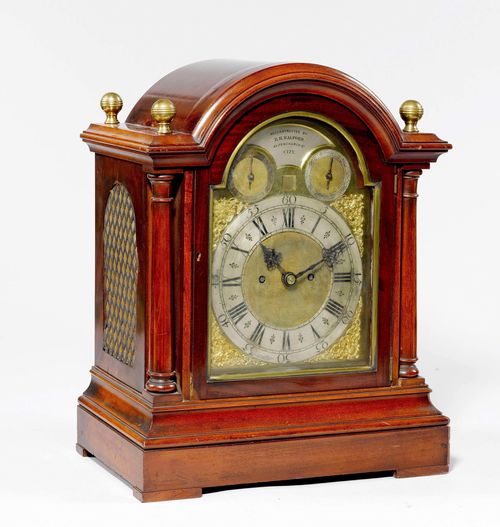 BRACKET CLOCK,Regency style, England. The dial inscribed RECONSTRUCTED BY R.H.HALFORD 43, FENCHURCH ST. CITY. Mahogany. Rectangular case, the front with 2 free-standing pillars. Brass fronton with silver-plated chapter ring surrounded by pierced tendrils with heads of women. 2 auxiliary dials for setting the striking mechanism (not functioning). Movement with anchor escapement, striking the hour on bell. 38x21x46 cm.