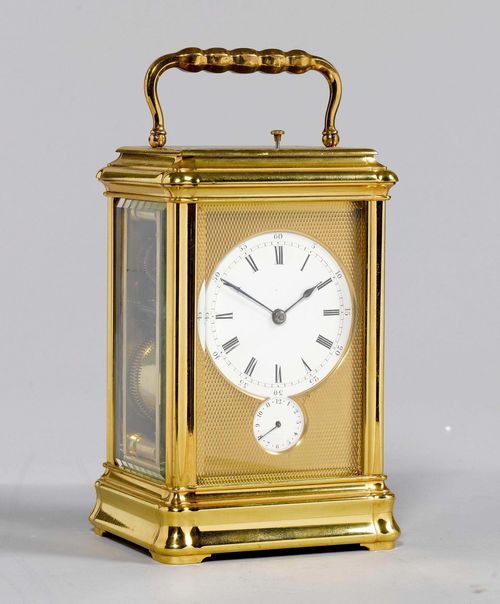 TRAVEL ALARM CLOCK,England or France, 2nd half of the 19th century. Gilt brass. Rectangular case with handle, glazed on all sides. Brass front with dial and small alarm dial. Movement with balance, striking mechanism striking the 1/2-hour on gong. Repetition on demand. Alarm on gong. 12x11x19 cm. 1 key.