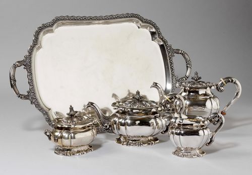 COFFEE AND TEA SET WITH TRAY,Italy, 20th century. In the Baroque style. Comprising: teapot, coffeepot, cream jug and sugar bowl, and tray with handles. Bone insulating rings in part missing. H of the coffeepot 22 cm, total weight 5355 g.