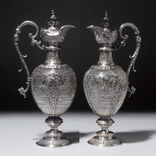 PAIR OF GLASS CARAFFES WITH SILVER MOUNTS,20th century. In the Renaissance style. H 39 cm.