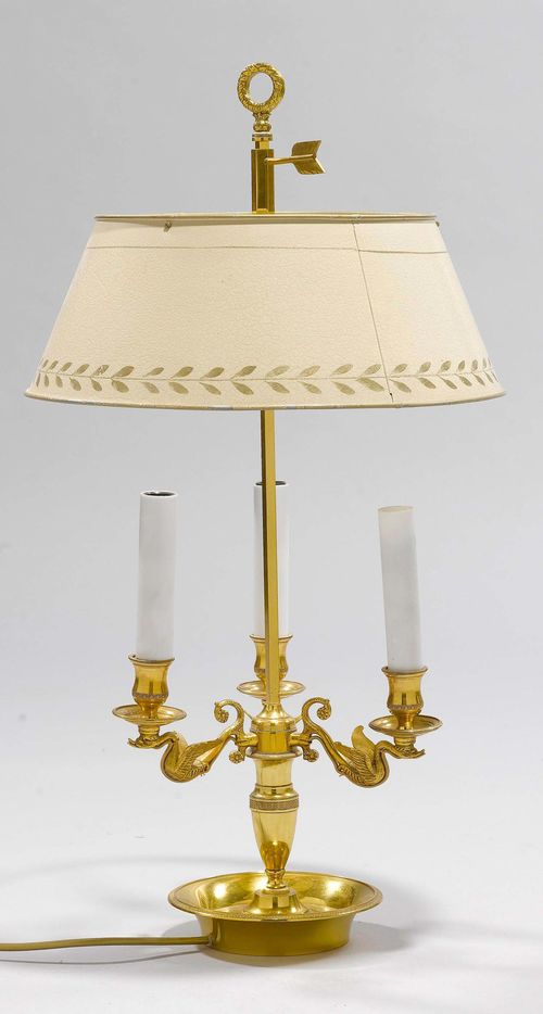 BOUILLOTTE LAMP,France, 19th century. Gilt bronze. Vase-shaped shaft with 3 curved light branches, round drip pans and nozzles. Height-adjustable, round metal shade. Painted off-white. On a round base. H 69 cm. Fitted for electricity.