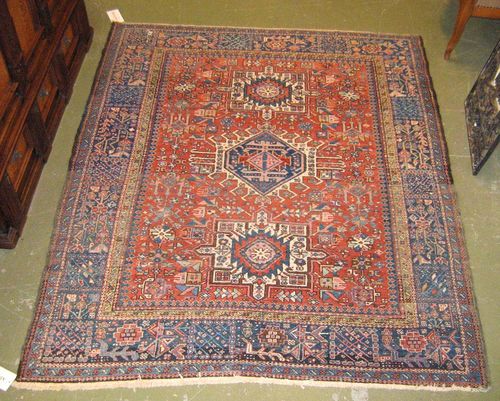 KARAJA old.Red central field with three medallions, geometrically patterned, blue border, signs of wear, 186x154 cm.