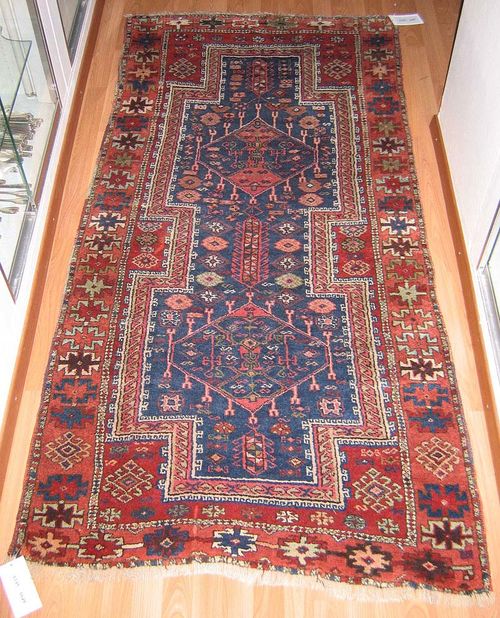 CAUCASIAN old. Red central field with a blue central medallion, the entire carpet is geometrically patterned, pink border with stars, good condition, 200x97 cm.
