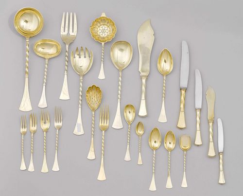 LARGE SILVER-GILT SET OF CUTLERY,Austria, 20th century. Maker's mark: NK. Silver 800. Made up of two almost identical sets. Comprising: 72 forks, 26 knives, 30 soup spoons, 30 appetiser forks, 30 appetiser knives, 30 fish forks, 30 fish knives, 30 dessert spoons, 30 tea spoons, 12 cream spoons, 12 ice-cream spoons, 12 cake forks, 30 fruit forks, 30 fruit or dessert knives, 35 mocha spoons, 44 serving utensils. 483 items in total. Total weight 22060 g.