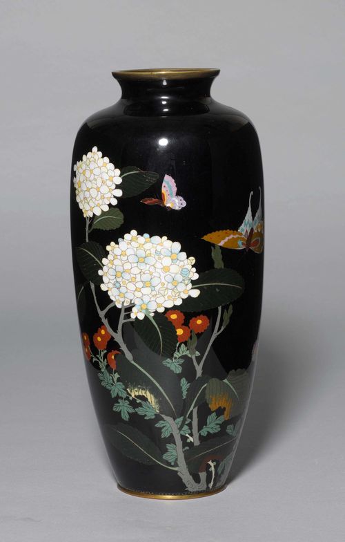 A CLOISONNÉ BALUSTER VASE WITH BLOSSOMS AND BUTTERFLIES ON A BLACK GROUND. Japan, Meiji Period, Height 38 cm.