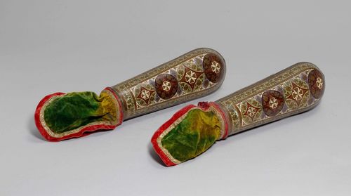 A PAIR OF COPPER AND POLYCHROME ENAMEL FOREARM GUARDS. India, Length 32 cm (without fabric).